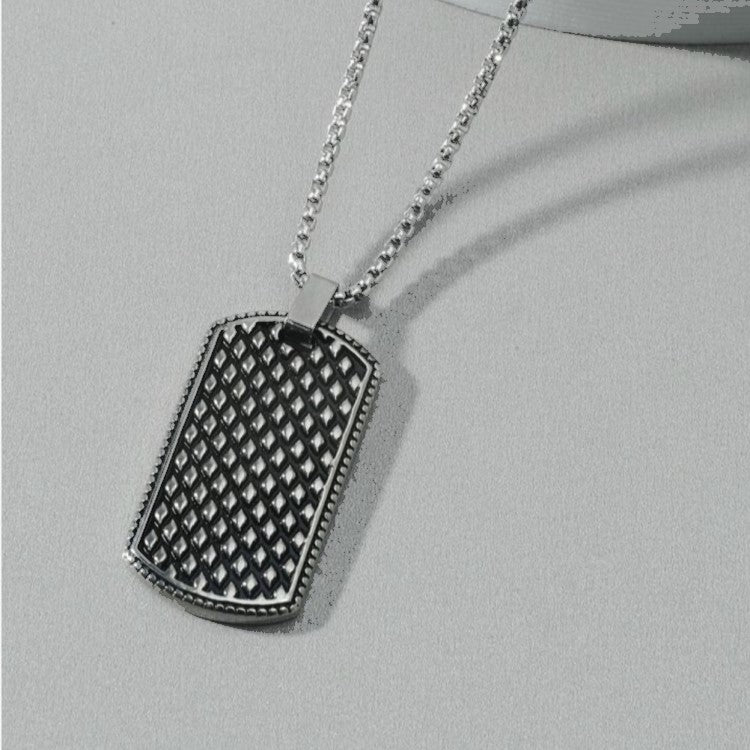Stainless steel dog tag pendant with chain, T.M.J brand, featuring a sleek, durable design for everyday wear.