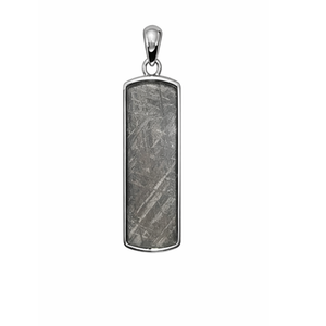 Sterling silver Gibeon meteorite bar pendant from T.M.J, featuring a sleek rectangular design with natural meteorite surface.