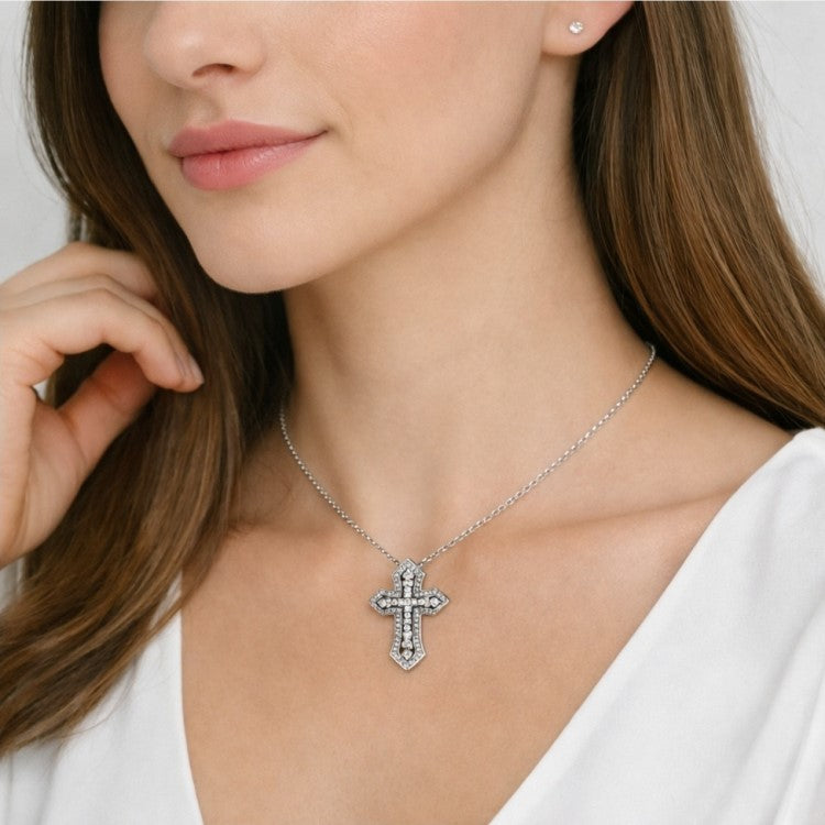 Sterling silver Duetta Dual Cross Pendant Necklace by T.M.J, featuring two overlapping religious cross charms.