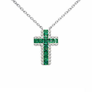 Green sterling silver cross necklace by T.M.J, religious jewelry with a detailed cross pendant on a chain.