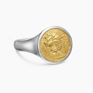 Sterling silver Nemean Lion signet ring with 18k gold accents by T.M.J, showcasing detailed lion design on a silver ring.