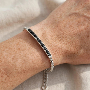 Cassiopeia steel bar bracelet by T.M.J with black CZ stones, made of stainless steel, featuring sleek, modern design.