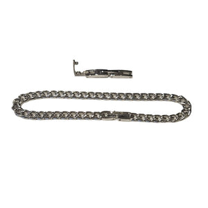 Stainless steel and gold-plated curb link bracelet, 5mm width, T.M.J brand, 19.5cm length, stylish jewelry accessory.