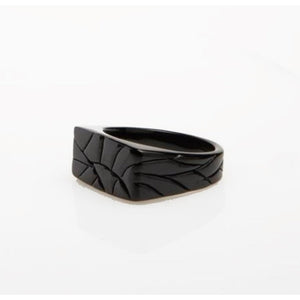 Men’s stainless steel ring with a crazy pattern finish by T.M.J, featuring a bold, intricate design on a silver band.