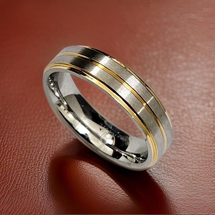 Satin finish stainless steel ring with gold accents, stylish T.M.J stainless steel ring, close-up view of elegant jewelry design