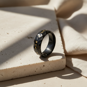 Erebus men's stainless steel ring with meteorite and gold Damascus steel design, featuring intricate patterns and a bold style.