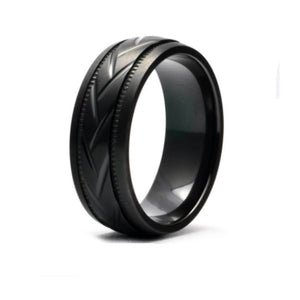 Black zirconium patterned men's stainless steel ring by T.M.J with intricate design and polished finish.
