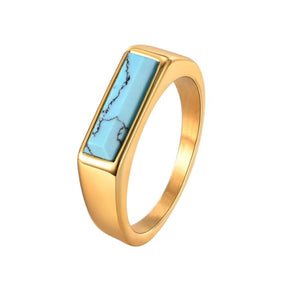 T.M.J gold-plated steel signet ring with turquoise inlay, featuring a stylish stainless steel design and intricate detailing.