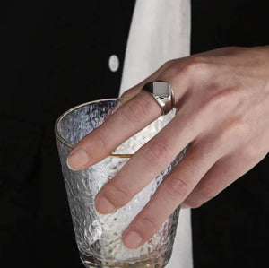 Men’s stainless steel square face ring in polished silver or gold, featuring modern elegance and a bold silhouette.