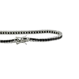 Sterling silver princess cut black CZ tennis bracelet by T.M.J, featuring a sleek design and sparkling black cubic zirconia stones.