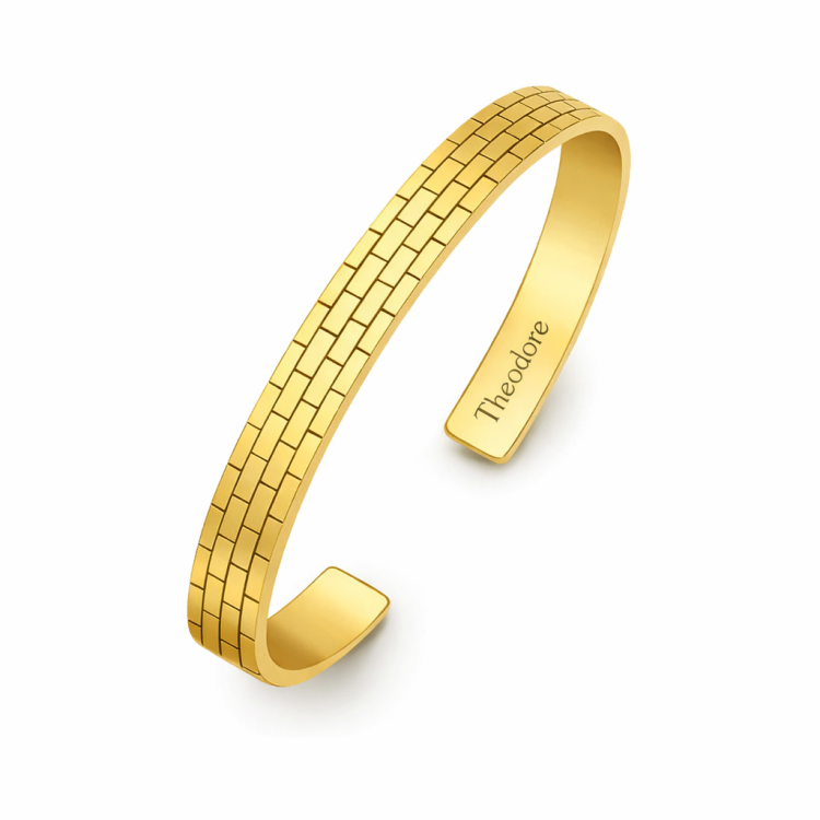 Sterling silver brick pattern cuff bangle bracelet by T.M.J, showcasing a textured geometric design on a sleek silver band.