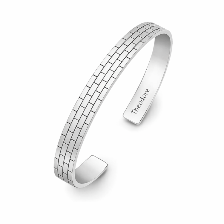 Sterling silver brick pattern cuff bangle by T.M.J, featuring a textured, modern design on a stylish bracelet.