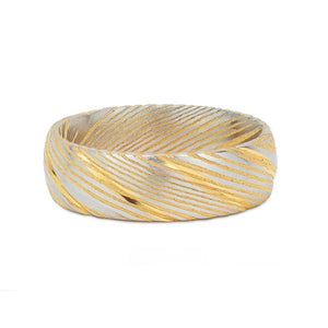 Polished gold Cerakote Damascus stainless steel ring by T.M.J, showing the Damascus steel interior and detailed craftsmanship.