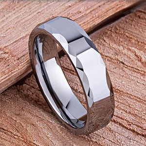 Silver tungsten carbide ring named The Rumba by T.M.J, featuring a sleek, polished finish with a modern design.