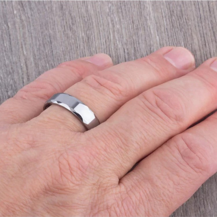 Silver Tungsten Carbide Ring called The Rumba by T.M.J, featuring a sleek polished finish and durable design.