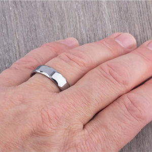 Silver Tungsten Carbide Ring called The Rumba by T.M.J, featuring a sleek polished finish and durable design.