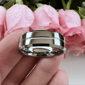 T.M.J tungsten carbide edge ring showcasing a polished silver finish and sleek design, ideal for men's jewelry.