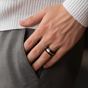 Classic black and gold tungsten carbide ring by T.M.J, featuring a sleek design with a polished finish and contrasting color accents.