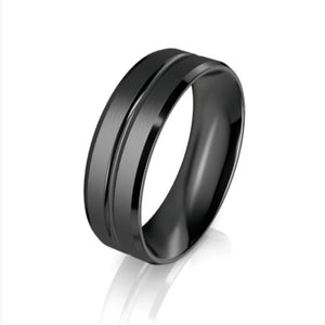 Black zirconium patterned men's ring from T.M.J, showcasing a sleek design with intricate patterning on the zirconium band.