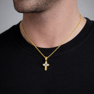 Gold and stainless steel small cross pendant with black stone inlay, featuring a detailed religious jewelry design by TMJ.