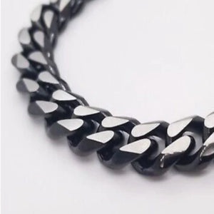 Matte black and stainless steel two-tone Cuban link chain necklace by TMJ, 50cm long, with bold interlocking links.