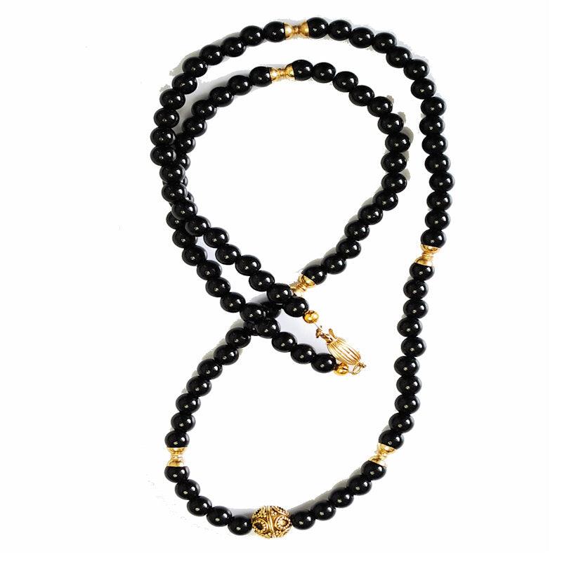 Black Agate and 9K Gold NecklaceBlack Agate and 9K Gold Necklace
Discover the power of Black Agate, the must-have protection stone, expertly handcrafted into a unique, meaningful necklace. Black AgBeaded NecklaceT.M.JTheodore Men's JewelryBlack Agate and 9K Gold Necklace