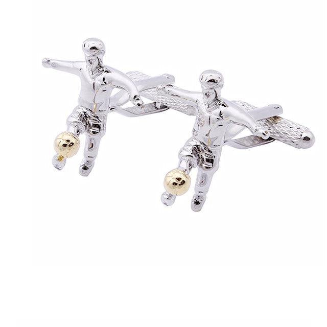 T.M.J silver novelty soccer cufflinks for men featuring a player kicking a gold-tone soccer ball