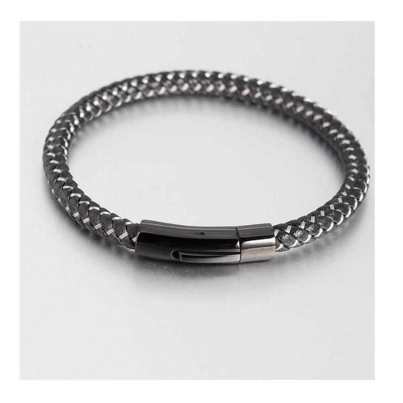 Black and silver stainless steel woven bracelet by T.M.J with metal clasp, stylish men's or women's jewelry accessory.
