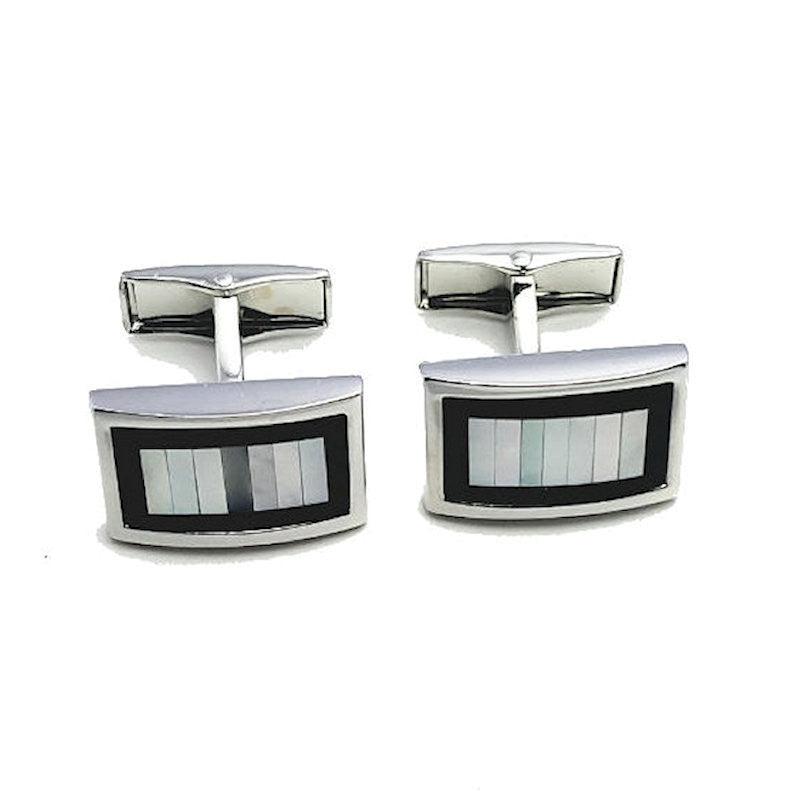 Elegant T.M.J. men's cufflinks featuring mother of pearl and onyx, showcasing a polished, sophisticated accessory for formal attire.