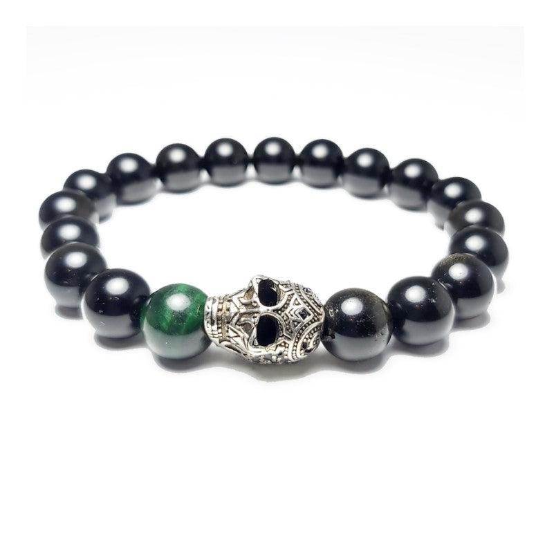 Gold Obsidian and Green Tiger Eye Skull BraceletObsidian Stone is a powerful cleanser of psychic smog created within your aura, and is a strong psychic protection stone. This stone has powerful metaphysical properBead BraceletsT.M.JTheodore Men's JewelryGold Obsidian and Green Tiger Eye