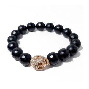 Skull and Natural Stone Beads BraceletDESCRIPTION
12 mm Black Faceted Onyx Beads
16 x12 mm Gold Pave Skull Spacer
Handcrafted in Melbourne Australia
Covered by our 1-year warranty
Comes with a presBead BraceletsT.M.JTheodore Men's JewelrySkull and Natural Stone Beads
