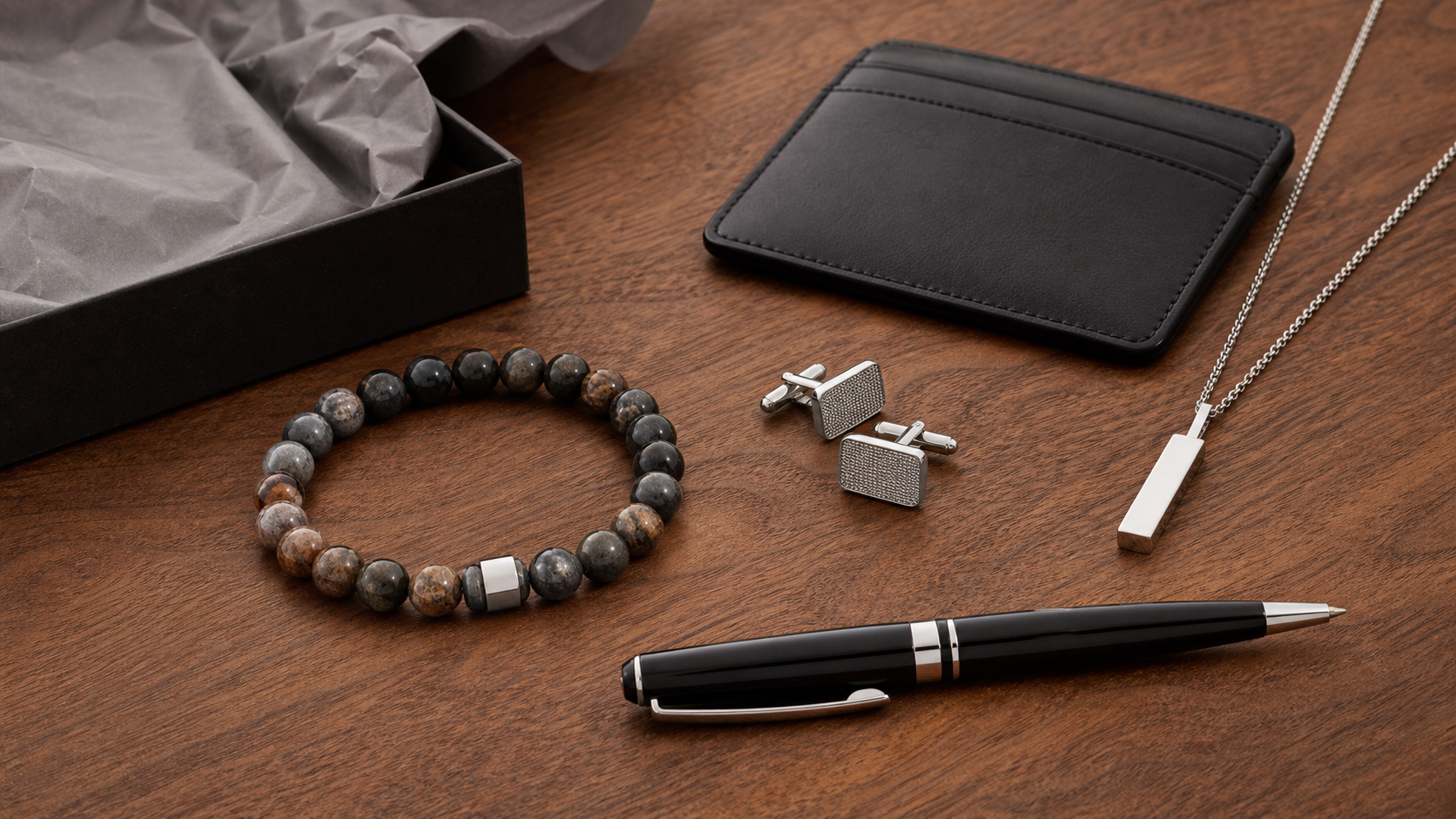 Men's bracelet, cufflinks, pendant, card holder and pen arranged as gifts