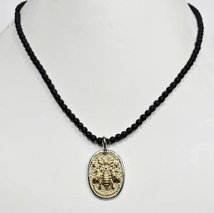 Black onyx beaded men's necklace with a two-tone bee pendant