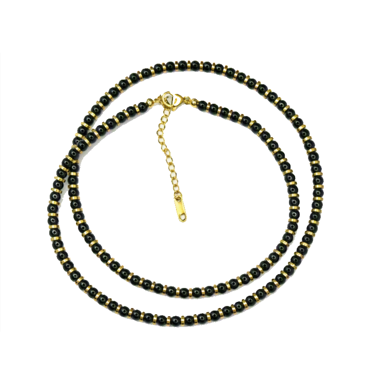 Onyx and gold hematite beaded necklace with round black and metallic beads, featuring a classic design by T.M.J.