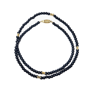 Beaded necklace featuring natural black onyx and 9k gold spacer beads, elegant jewelry piece by T.M.J