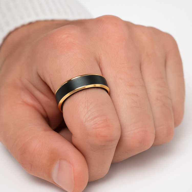 Black and gold tungsten carbide ring with satin black finish and polished gold beveled edges.