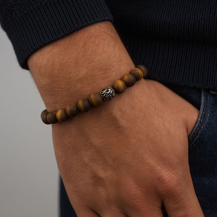 Matte Tiger Eye bead bracelet with stainless steel spacer on wrist, handcrafted in Melbourne.