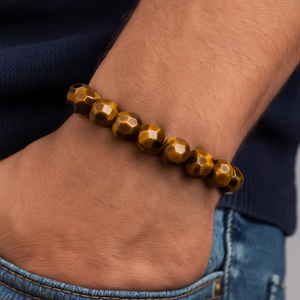 Multi Faceted Tiger Eye Bead Bracelet on wrist showcasing golden-brown sheen and faceted design.