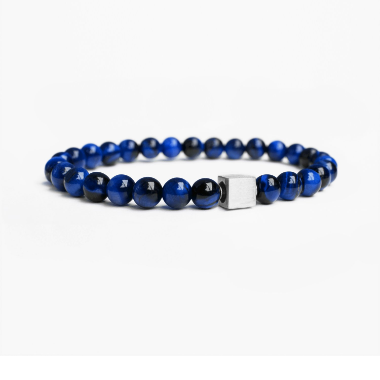 Dark Blue Tiger Eye bead bracelet with silver pave spacer bead on white background.