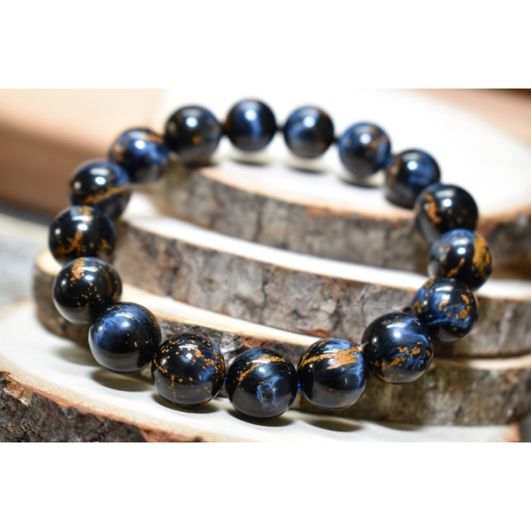 Namibia Natural Pietersite gemstone bead bracelet with blue and golden hues, elastic cord, and handcrafted design.