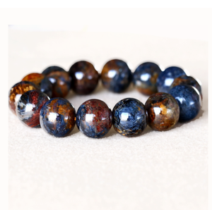 Namibia Natural Pietersite gemstone bead bracelet with multicolored stones on a stretchy elastic band.