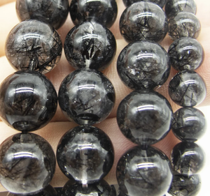 Black Rutilated Quartz beaded bracelet promoting spiritual growth, handcrafted in Melbourne.