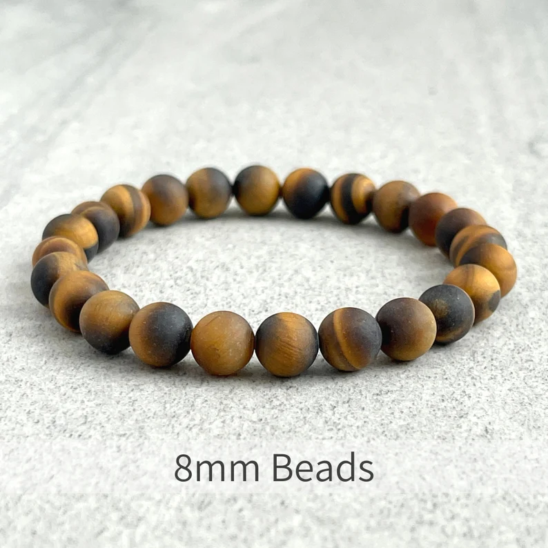 Matte Tiger Eye bead bracelet with gold spacer, 10mm elastic strand, handcrafted.