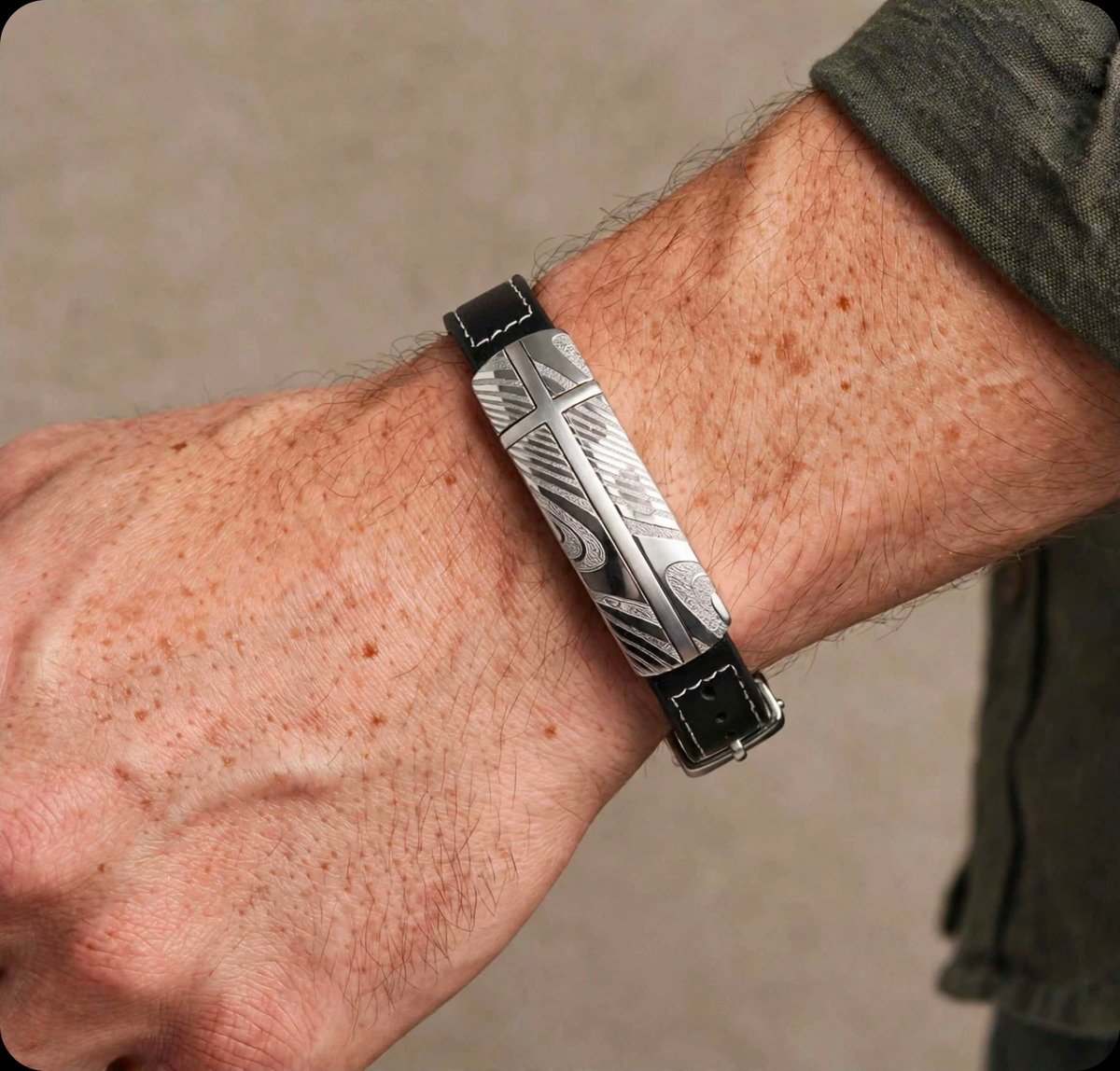 Damascus steel and black leather bracelet from T.M.J featuring a sleek, handcrafted design with metal accents and adjustable leather strap.