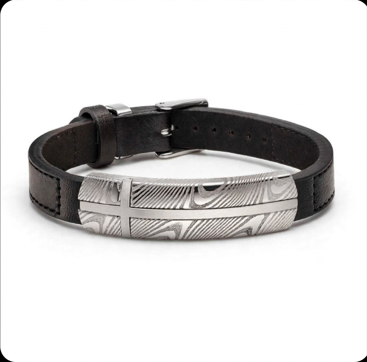 Damascus steel and black leather bracelet by T.M.J featuring intricate metalwork and sleek leather band.