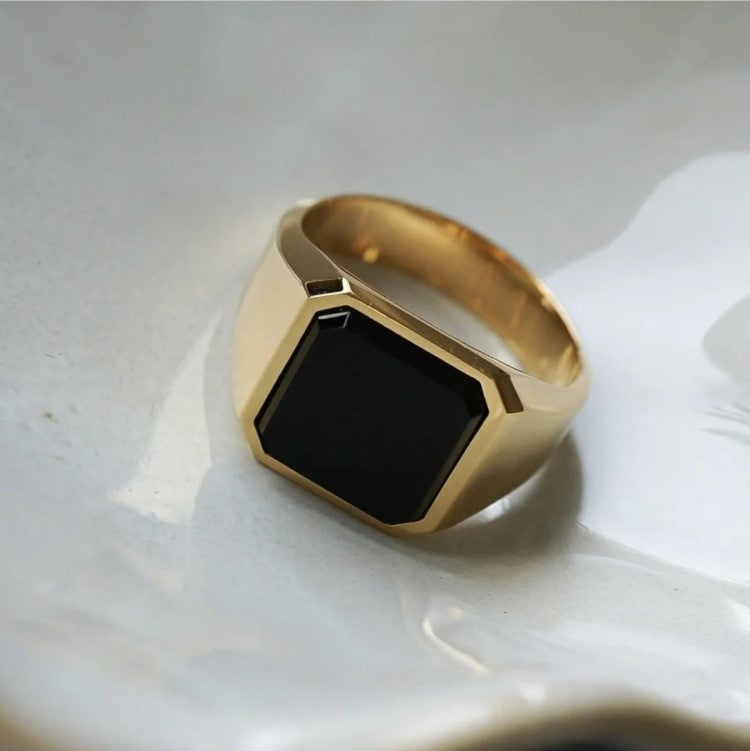 Stainless steel and black stone signet ring with matte finish.