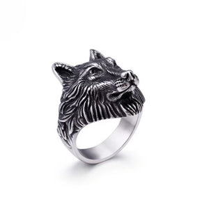 Stainless steel ring with wolf head pattern design.