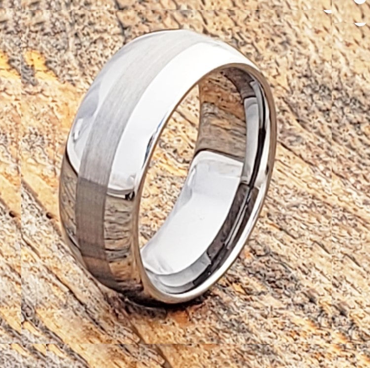 Silver Tungsten Carbide Ring with Satin Finish and Polished Edges on Wooden Background