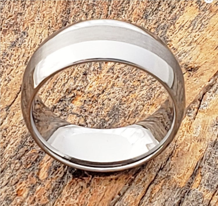 8mm Silver Tungsten Carbide Ring with Satin Finish and Polished Edges on Wooden Background.