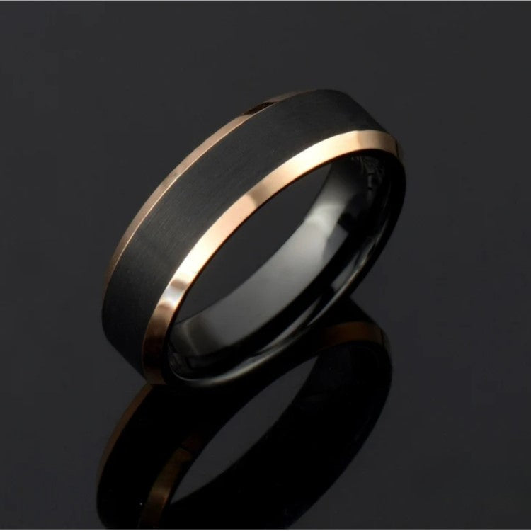 6mm black and gold tungsten carbide ring with satin black surface and polished yellow gold beveled edges.